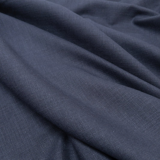 100% cotton apparel fabric in navy with a textured surface shown from above.