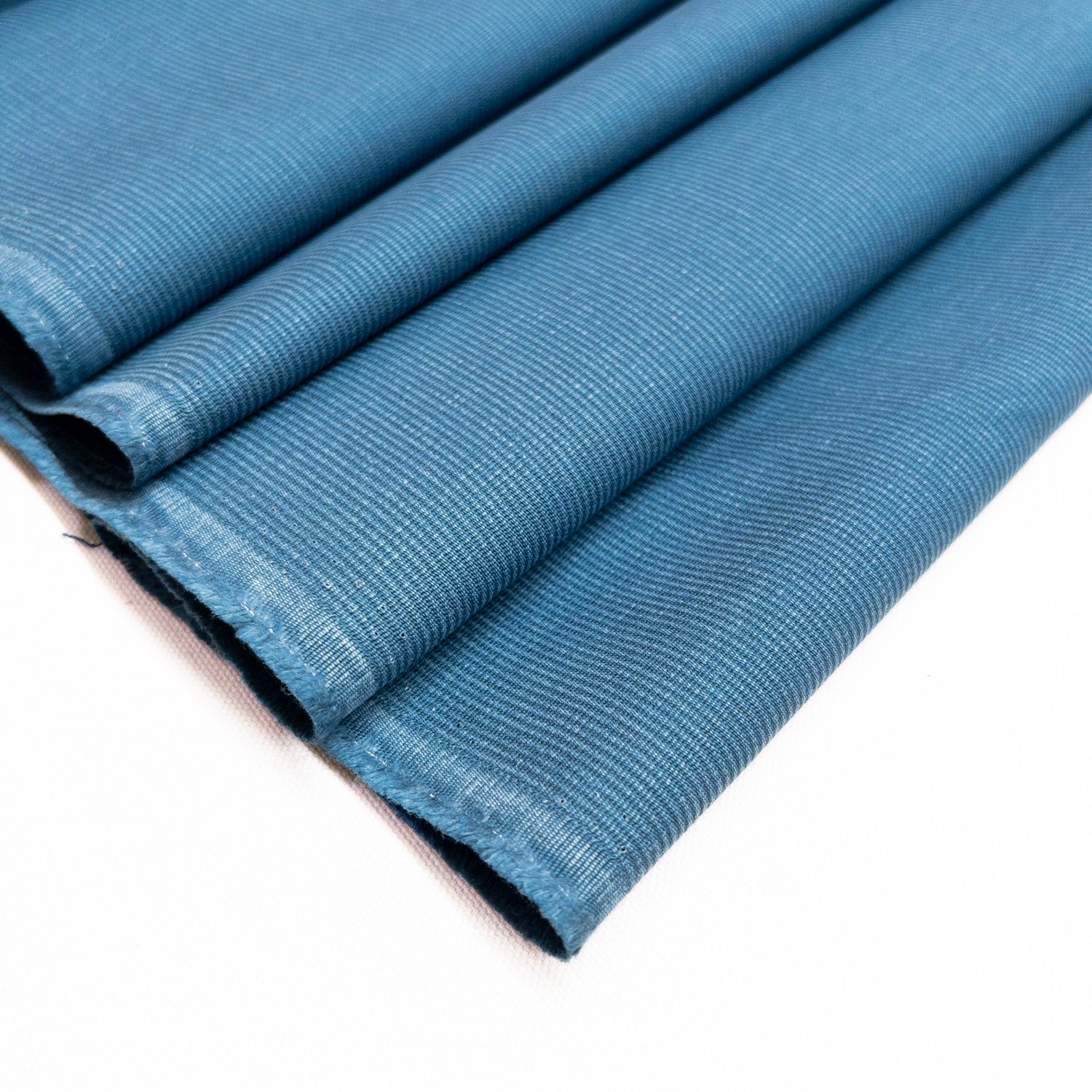 100% cotton bedford cord garment fabric in a pale blue shown folded.