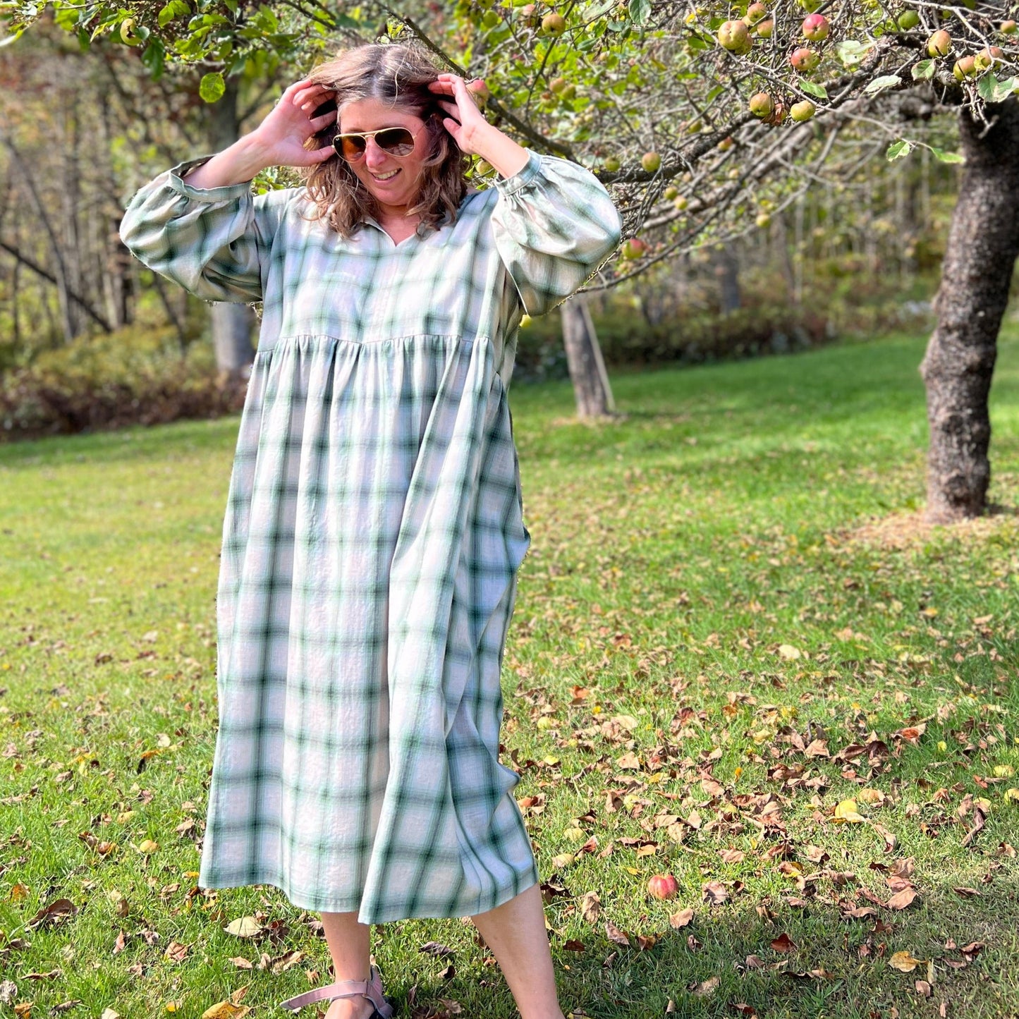 Woman standing in dress of fade in cotton.