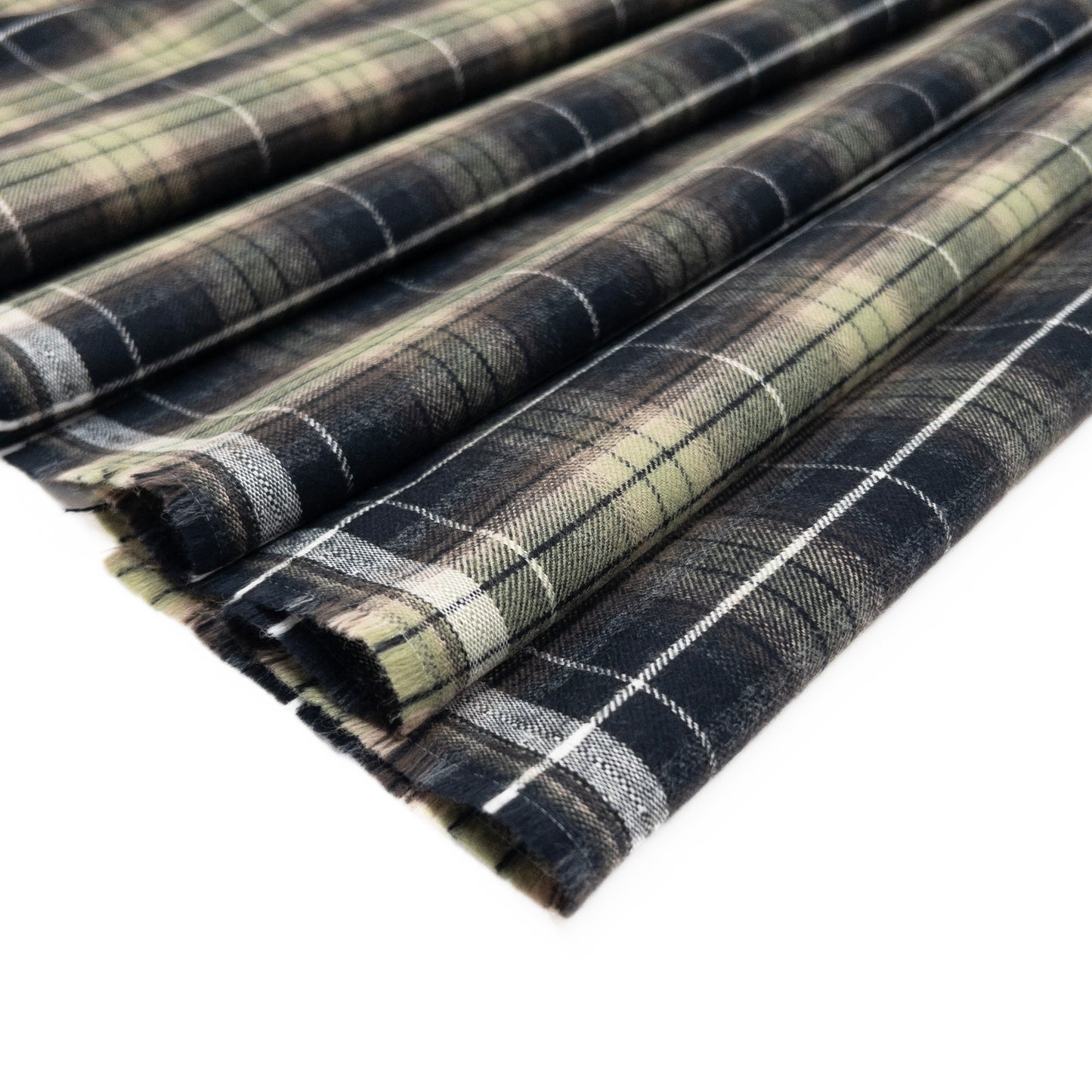 Green plaid flannel in cotton with brushed finish shown folded.