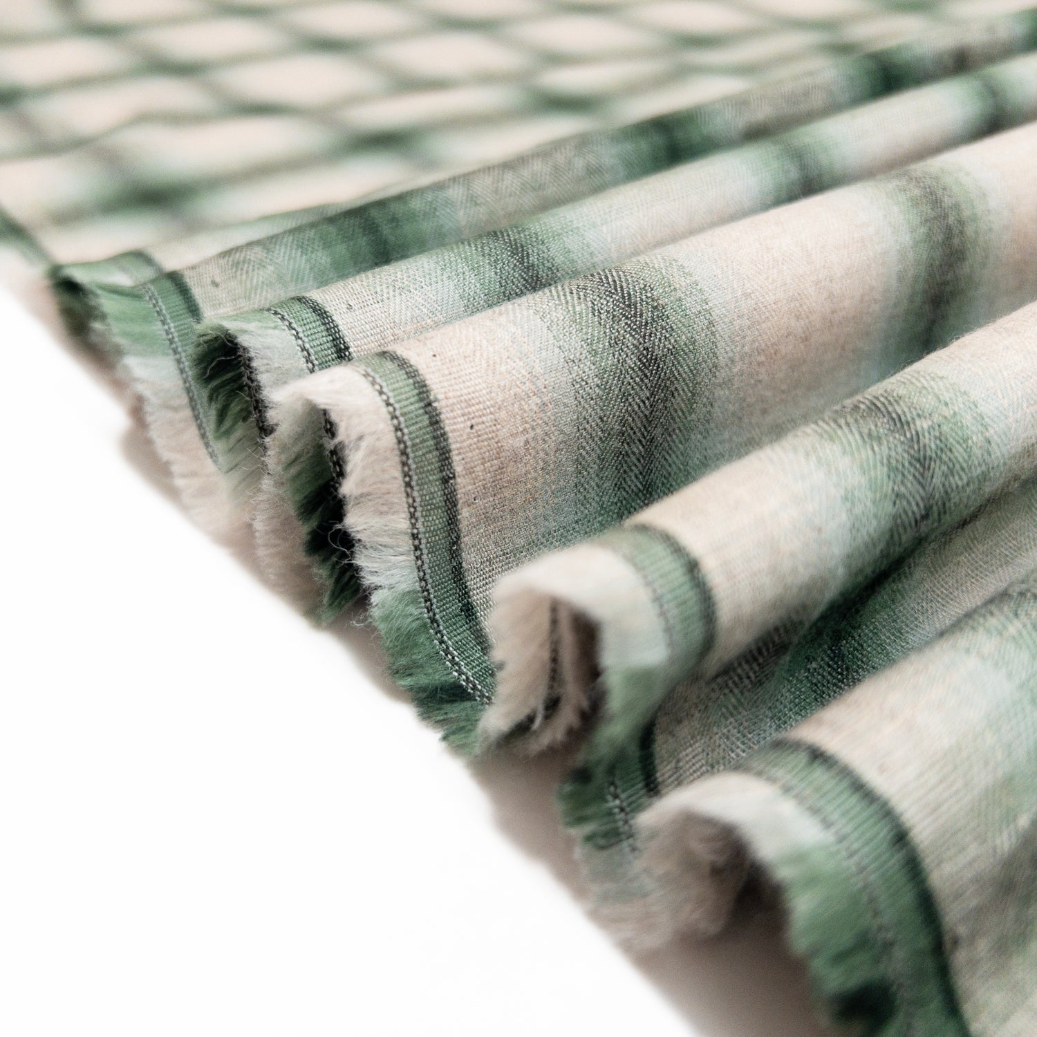 Ribbon view of the mineral green cotton shirting fabric from the fade in collection.