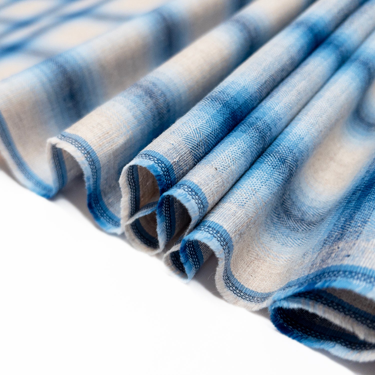 View from above of 100% cotton shirting fabric in shades of blue and natural