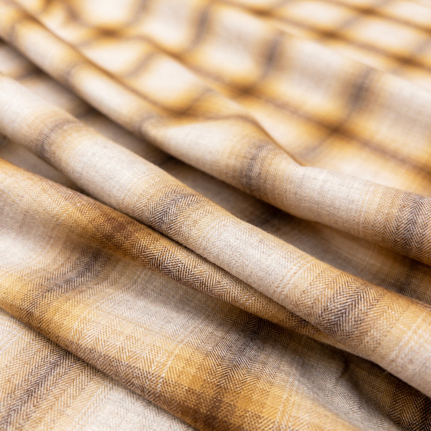 View of the face of this 100% cotton shirting fabric from the fade in collection folded to illustrate soft drape