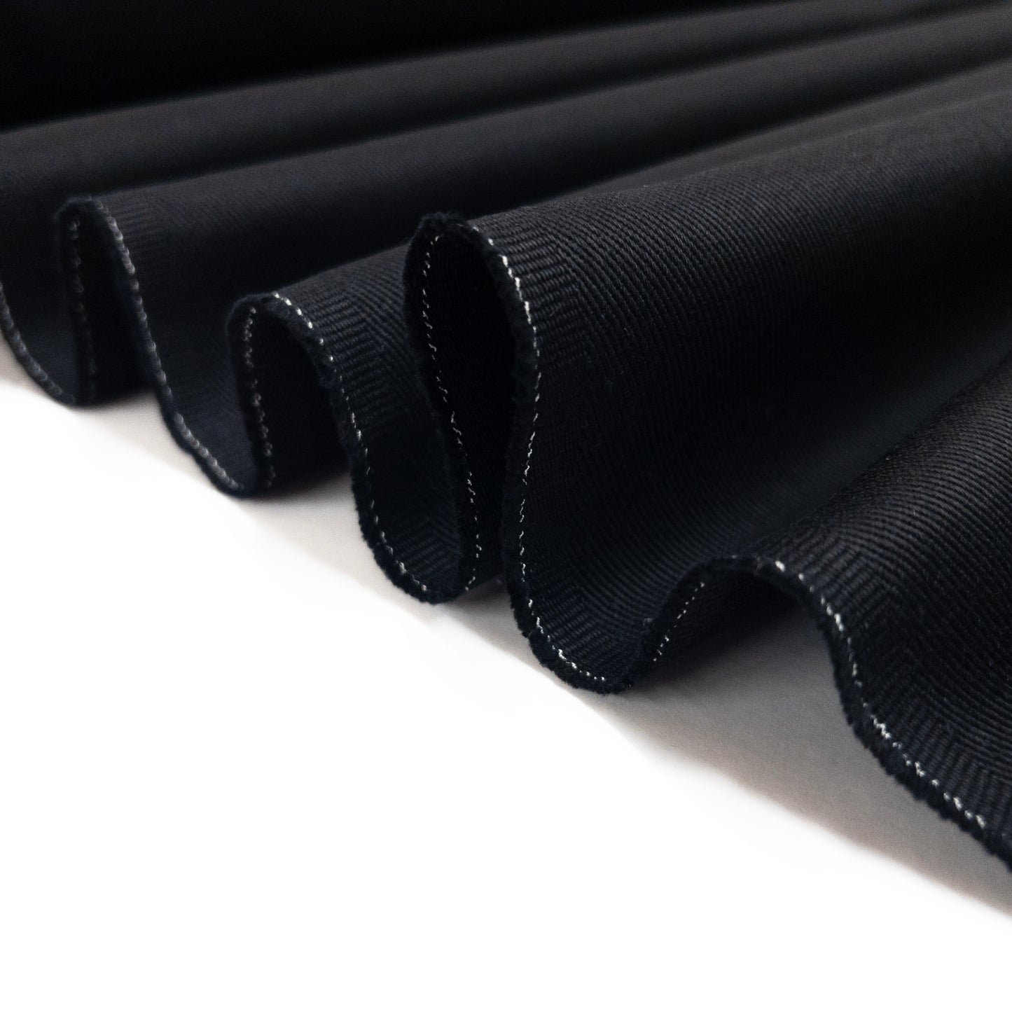 Quality cotton twill apparel fabric folded in a ribbon.