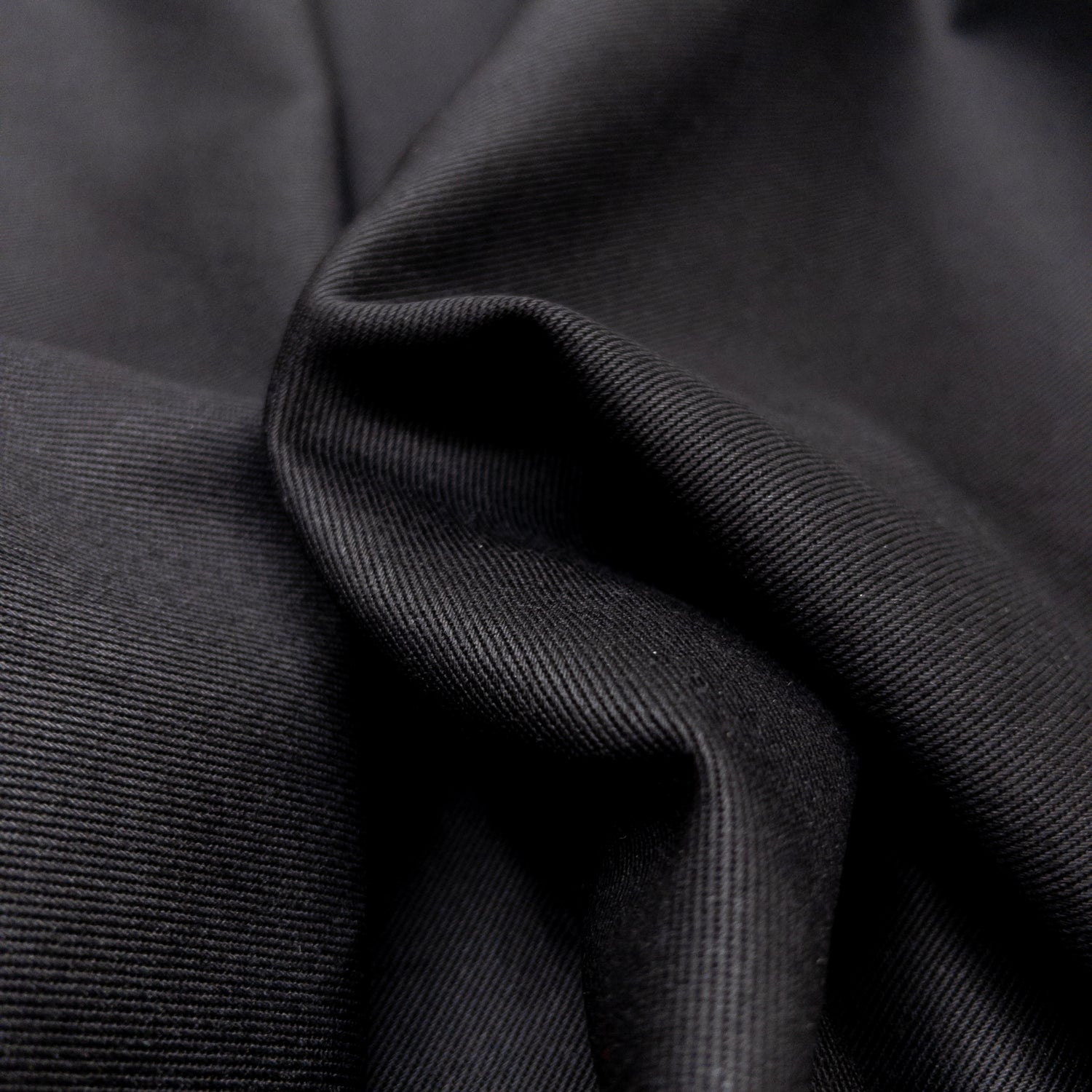 Close up view of cotton heavy twill fabric showing diagonal weave.