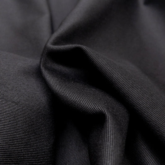 Close up view of cotton heavy twill fabric showing diagonal weave.