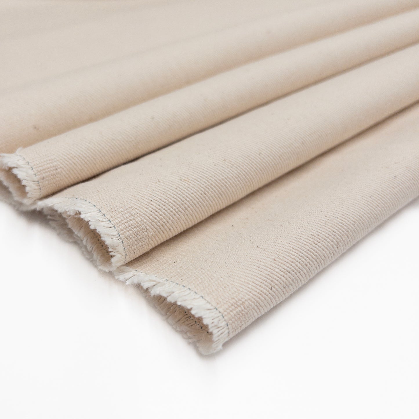 100% cotton twill fabric in natural shown folded