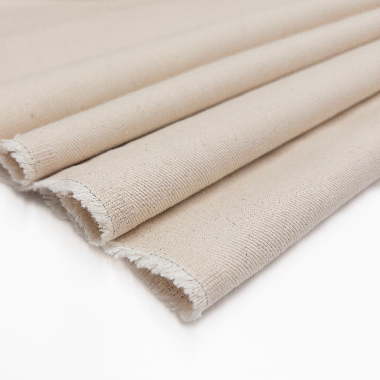 100% cotton twill fabric in natural shown folded