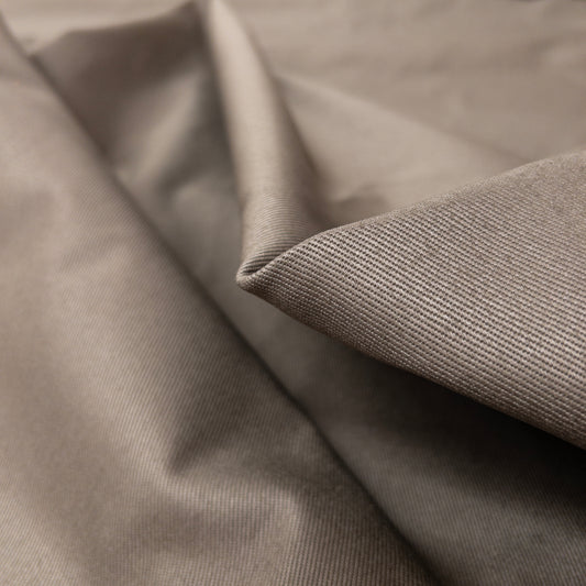 Close up view of heavy twill garment fabric with diagonal ribbing on fabric face