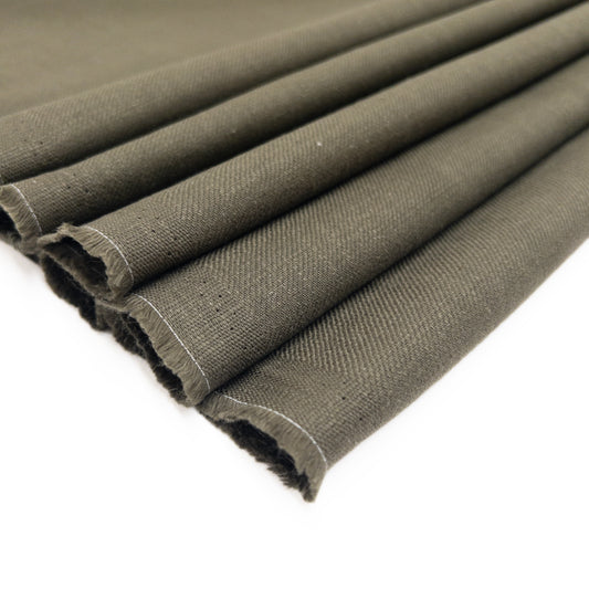 100% cotton garment fabric for shirts and pants patterns in an olive  green shown folded.