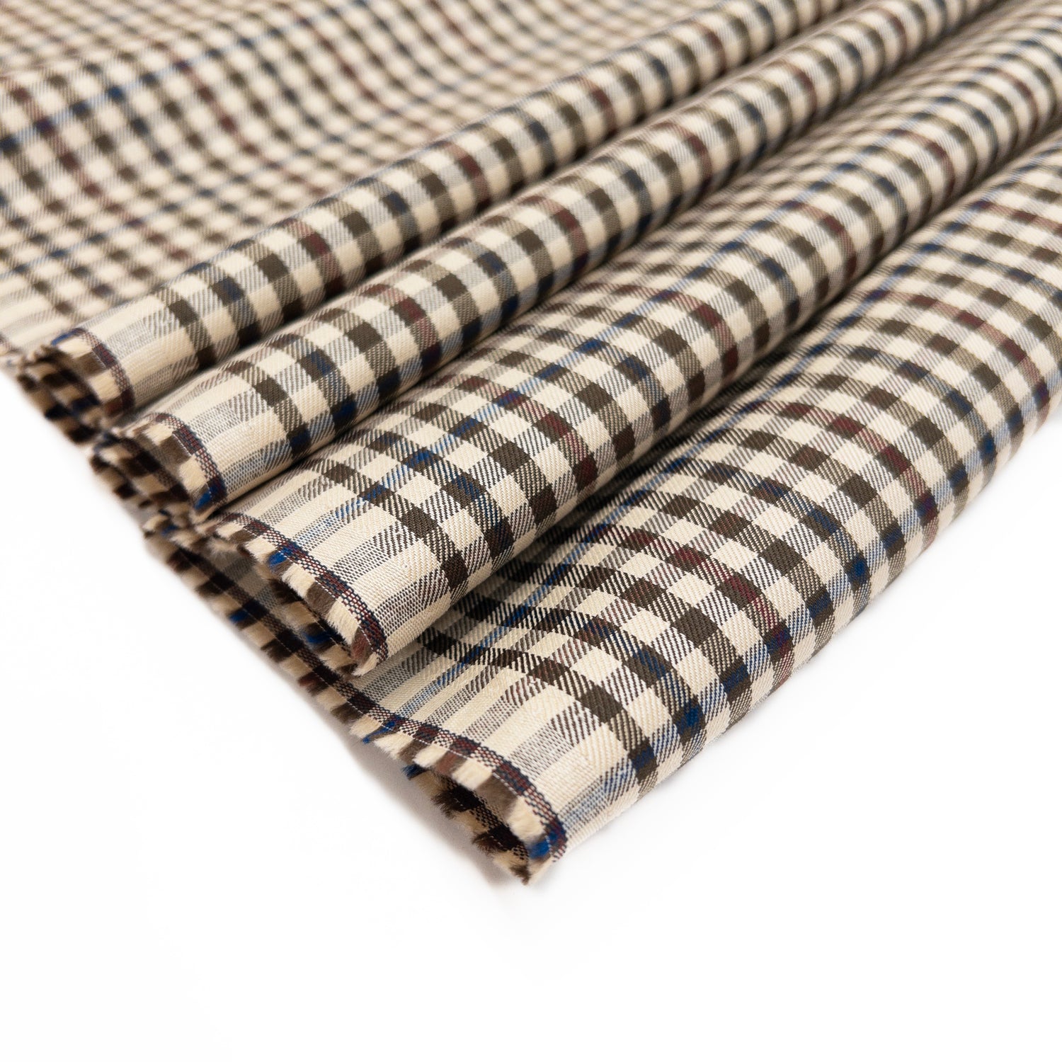 100% cotton shirting garment fabric with a check pattern shown folded.