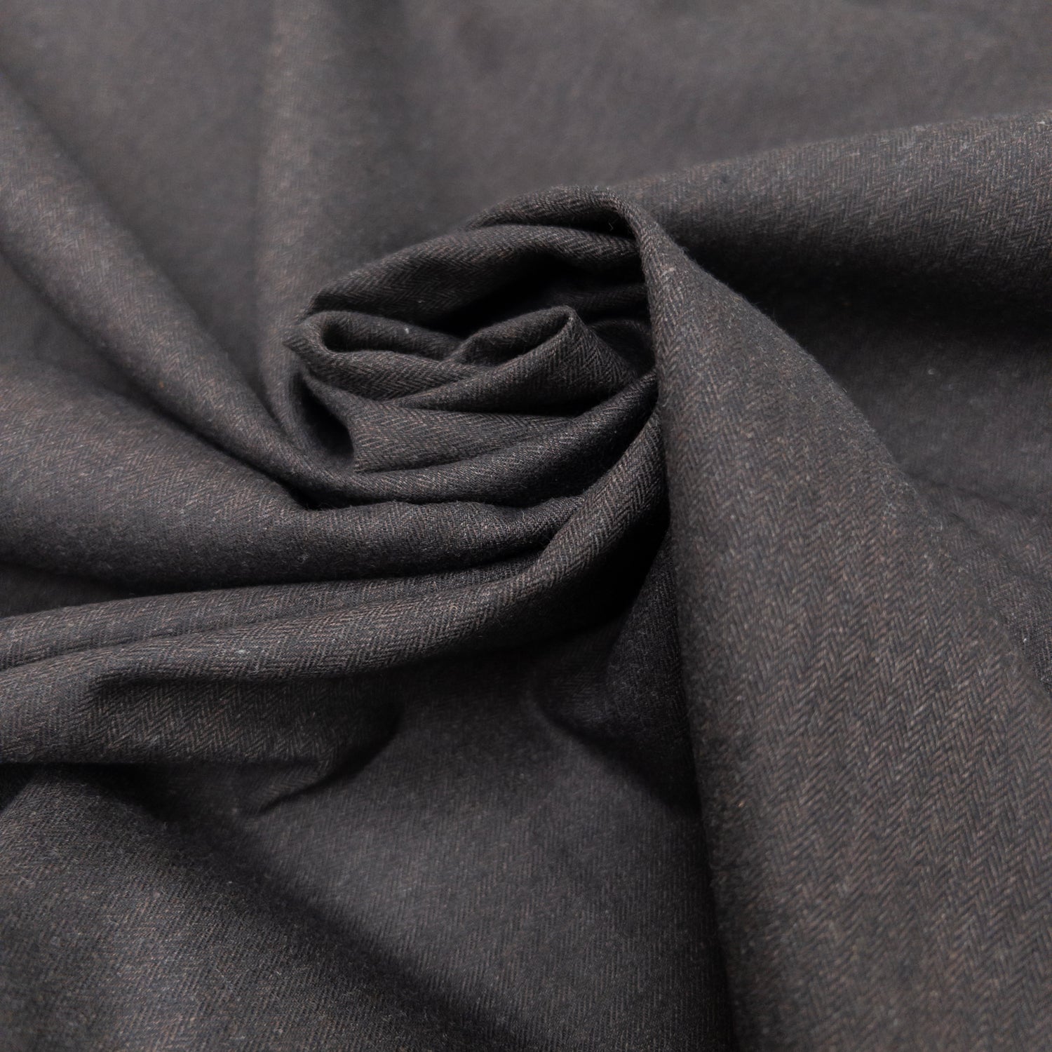 Garment fabric of cotton flannel shown twisted like a rose.