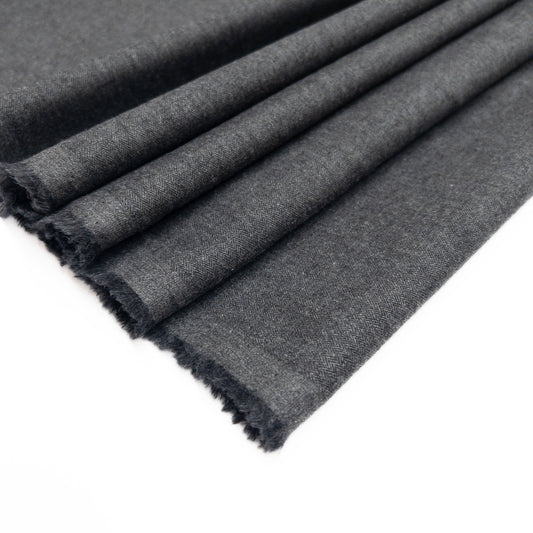 Grey cotton flannel clothing fabric for a tailored look, shown folded.