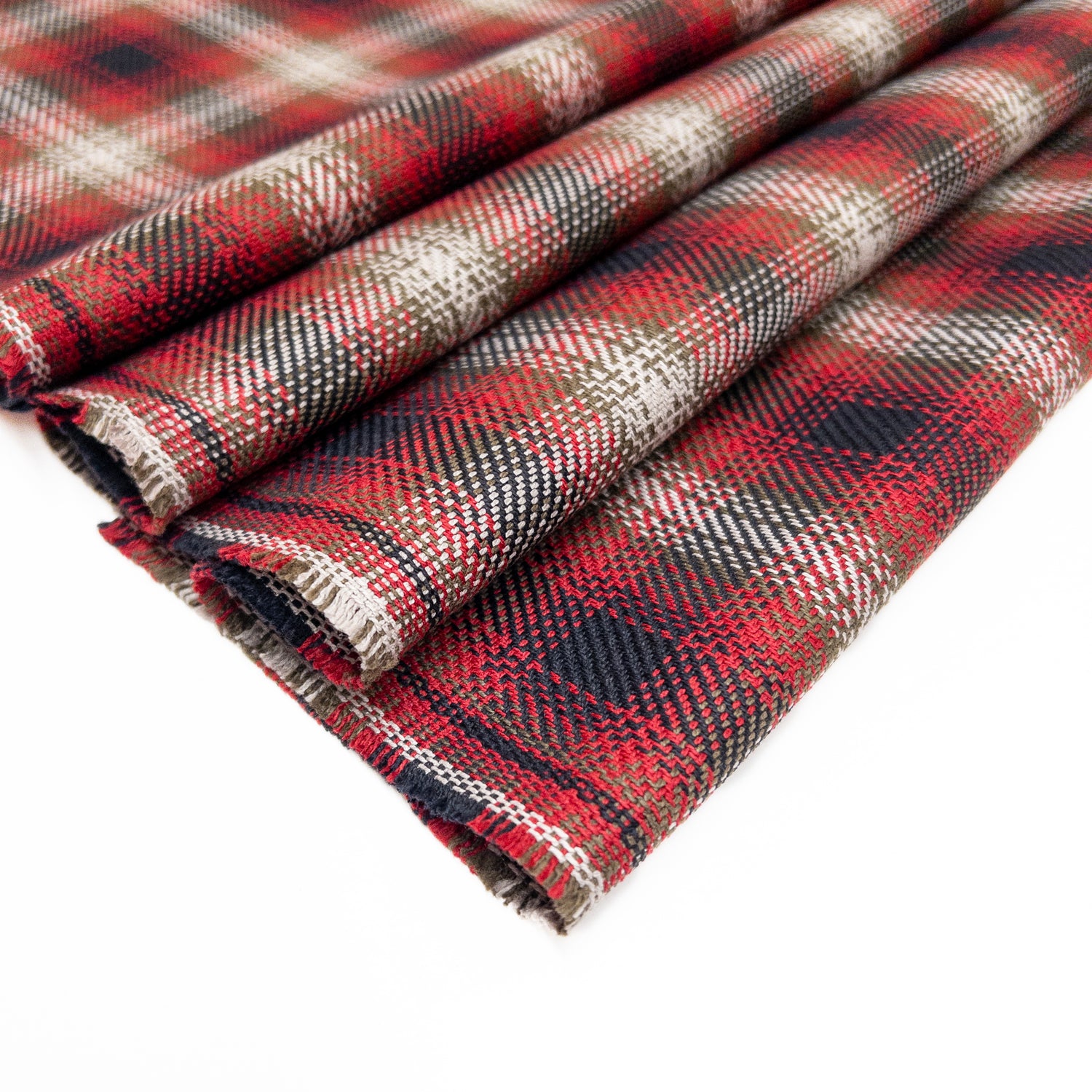 100% organic cotton tartan plaid in a twill weave shown folded from above.