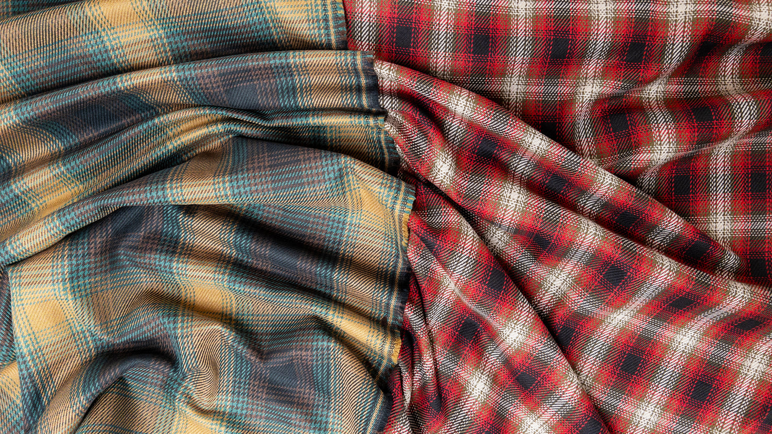 Two colorways of cotton tartan plaid a quality garment fabric for coating shown from above.