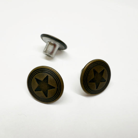 Image of 3 jeans buttons 15mm in width with 3 rings and a star pattern in antique brass.