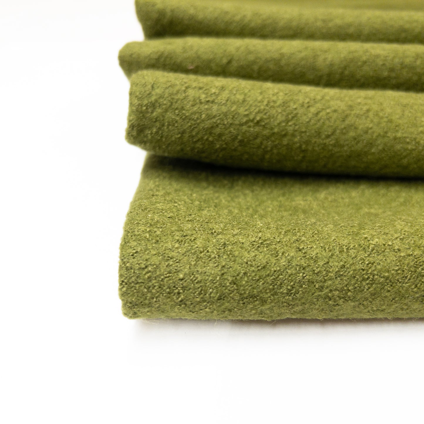 Detailed image of boiled wool garment fabric featuring a textured surface.