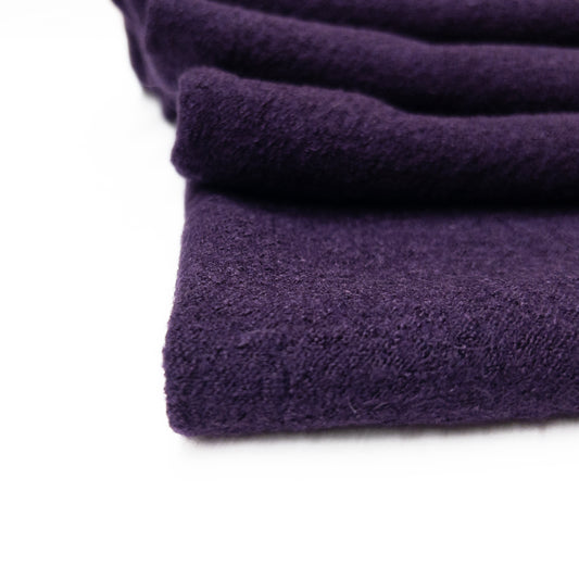 A detailed view of our purple nubby boiled wool garment fabric.