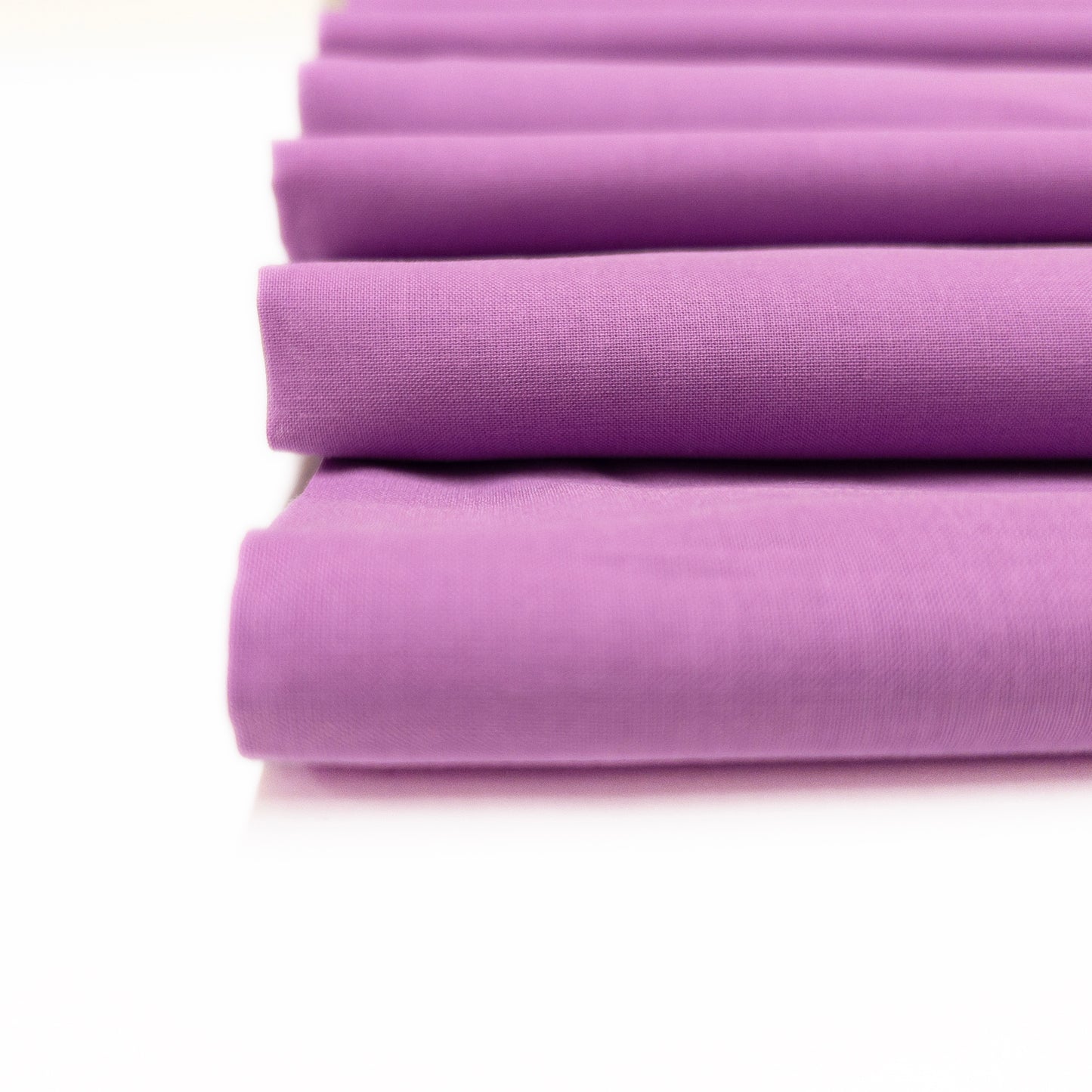 Detail image of amethyst cotton voile displaying the lightweave of the garment fabric