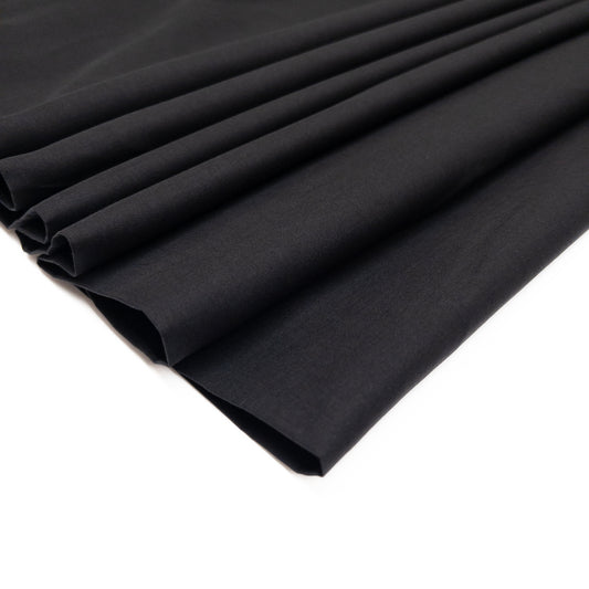 100% cotton voile fabric is semi-sheer and lightweight shown here from overhead, the fabric is folded over itself