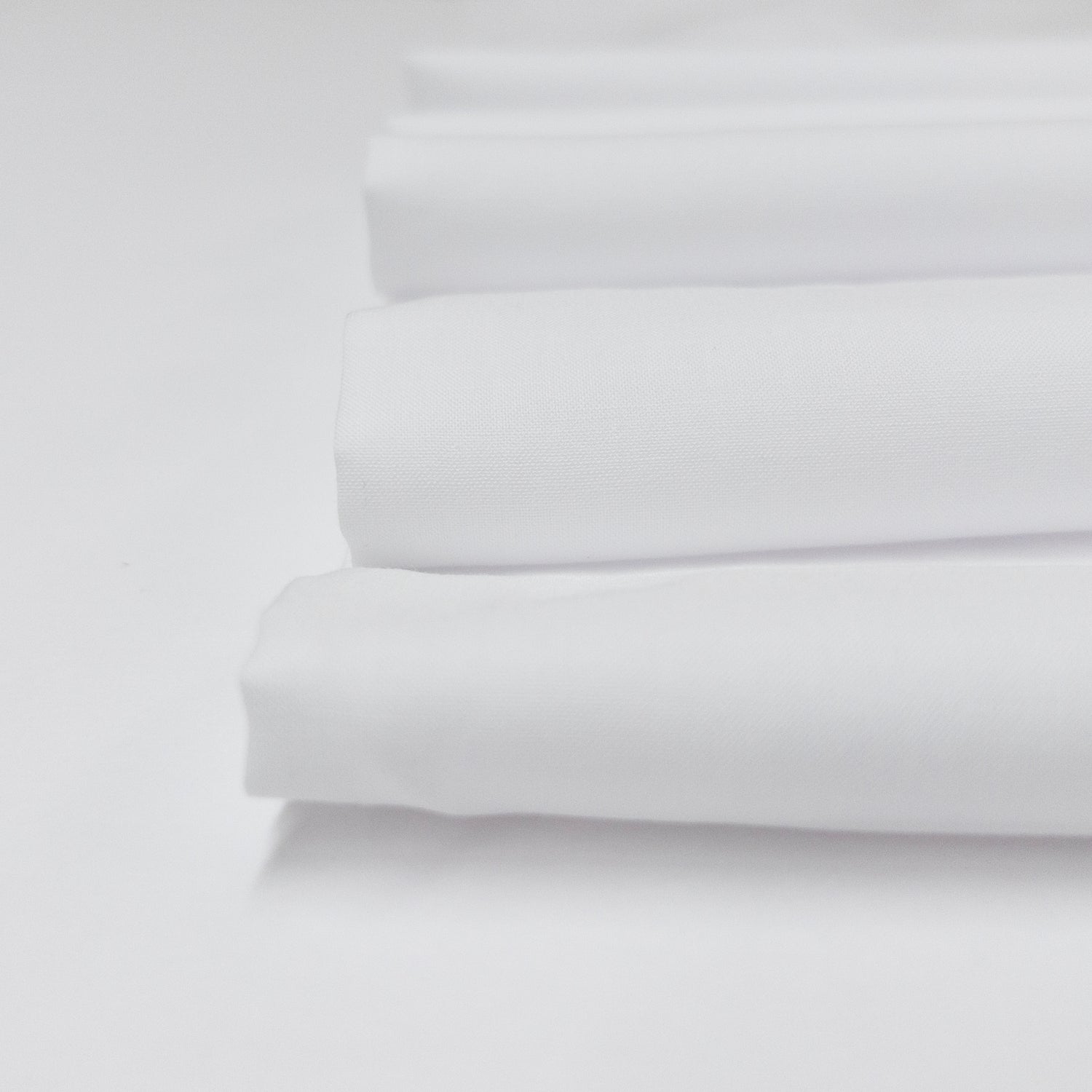 Detail view of crisp cotton voile in bright white.