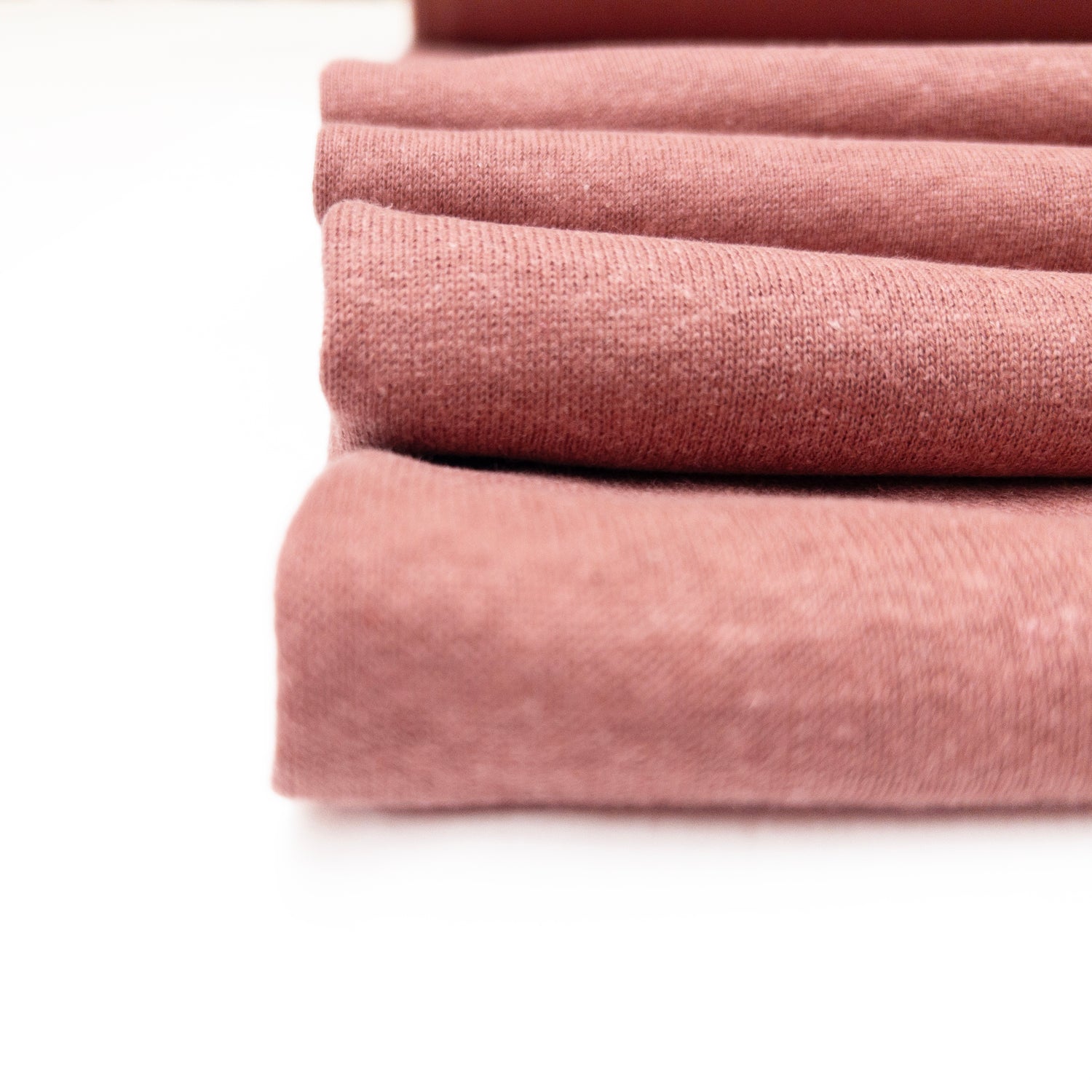 Pink knit with fleece back in organic cotton, hemp and bamboo in a detailed view.