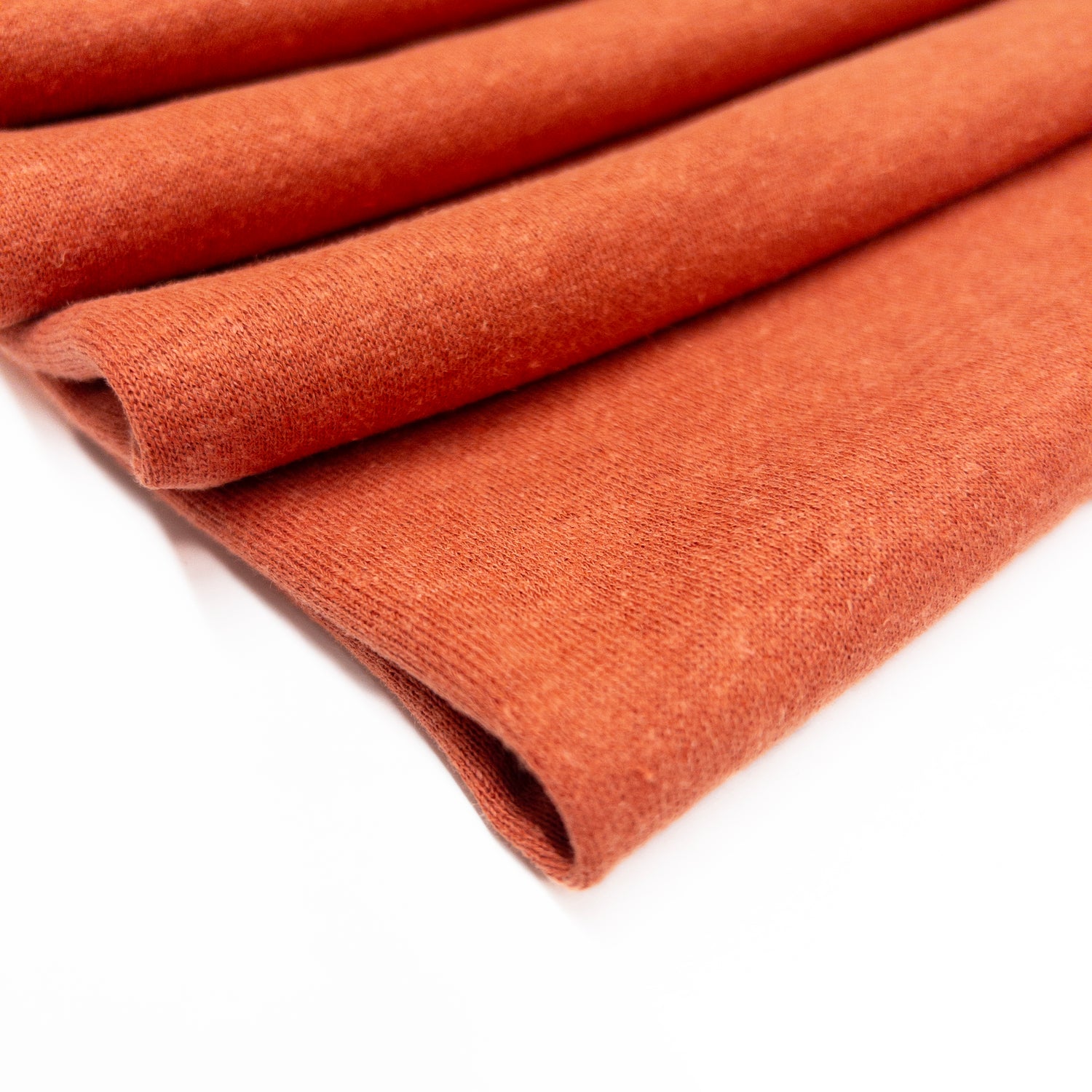 Organic Cotton blend fleece backed knit garment fabric folded.