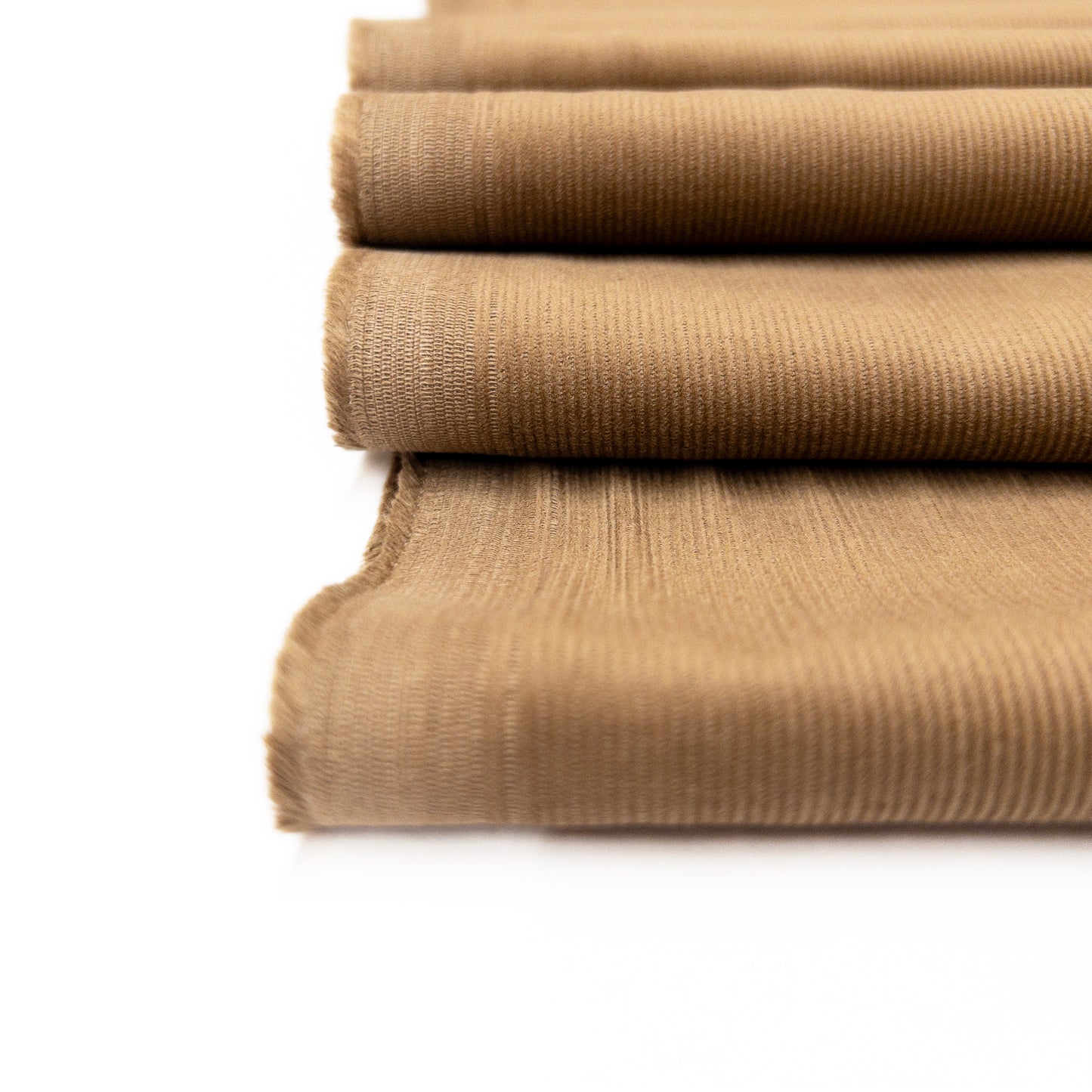 Close up view of the organic cotton  garment fabric illustrating small ribs of this baby corduroy